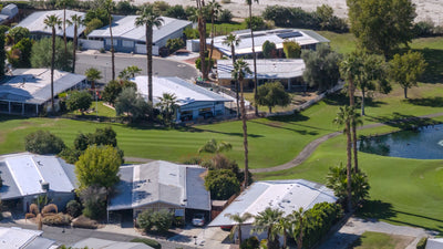 Date Palm Country Club homes overlooking a fairway and pond.