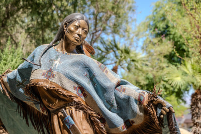 Face and painted clothing detail of Dave McGary’s Walks Among the Stars at Faye Sarkowsky Sculpture Garden, Palm Desert.