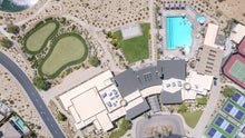 The Outlook clubhouse, putting greens and pool from directly above at Del Webb Rancho Mirage, California