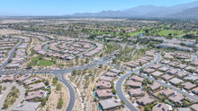 Wide aerial view of Del Webb Rancho Mirage homes and surrounding mountains at Del Webb Rancho Mirage, California
