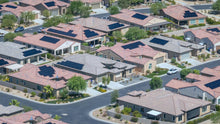 Aerial view of single-story homes with rooftop solar panels at Del Webb Rancho Mirage, California