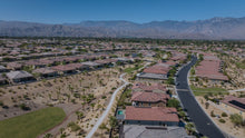 Residential streets and walking paths through desert landscaping at Del Webb Rancho Mirage, California