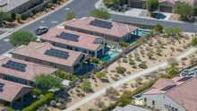 Solar-equipped homes alongside landscaped walking paths at Del Webb Rancho Mirage, California