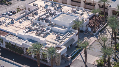 Elevated oblique view of the former Desert Magazine building showing its roof and commercial surroundings, October 15, 2026