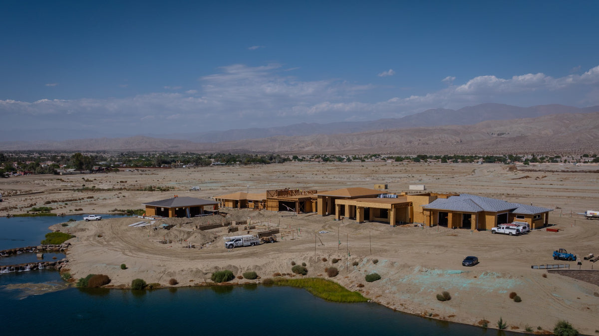Oasis Clubhouse construction beside the lake at Desert Retreat in Indio, photographed by Mark Miller on September 25, 2026.