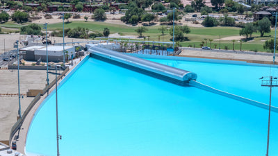 Aerial view of the Wavegarden wave generator and lagoon edge at DSRT Surf in Palm Desert, September 10, 2026.