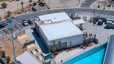 Buildings and skate area alongside the DSRT Surf lagoon in Palm Desert, photographed September 10, 2026.