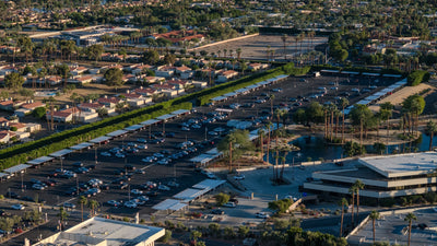 Covered parking beside palms and a landscaped pond at Eisenhower Medical Center.