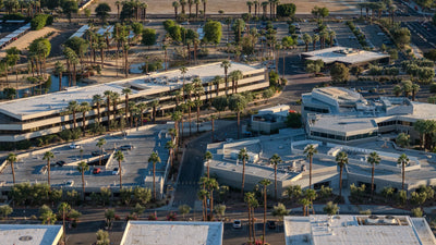 Medical buildings, palm-lined roads and parking areas on the Eisenhower campus.