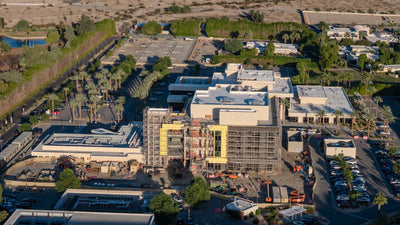 Scaffolding and construction equipment around a building on Eisenhower Medical Center’s campus.