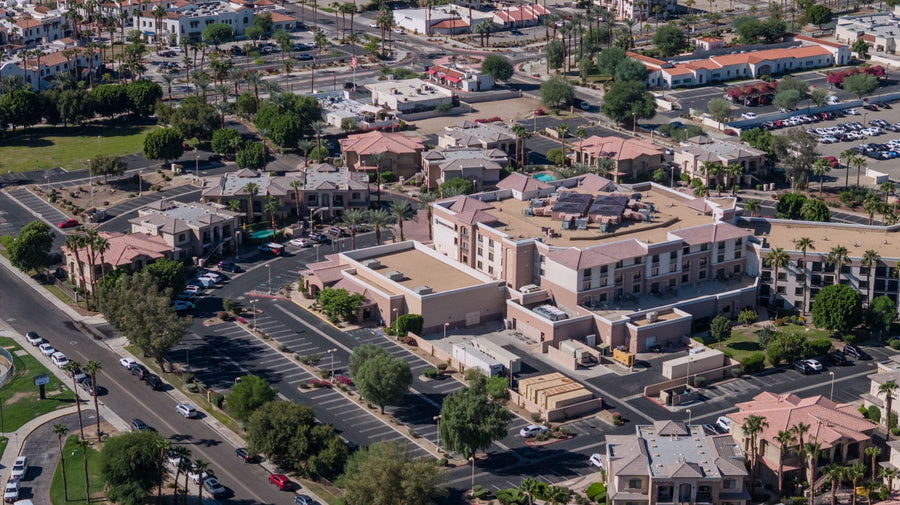 Elevated view of Embassy Suites La Quinta Hotel and Spa, with Old Town La Quinta and nearby streets in the background.