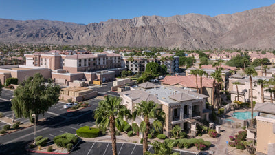 Embassy Suites La Quinta with the Santa Rosa Mountains behind the hotel and neighboring residences in the foreground.