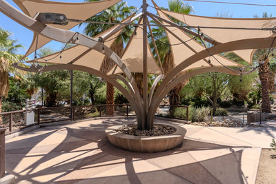 Fabric shade canopy and branching pavilion structure at Faye Sarkowsky Sculpture Garden in Palm Desert.