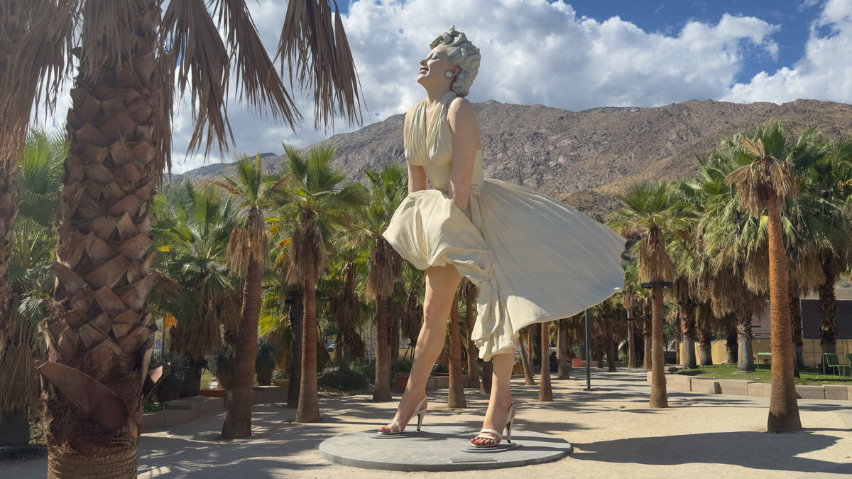 Forever Marilyn by Seward Johnson among palms in Palm Springs Downtown Park, with mountains behind. Photograph by Mark Miller, October 20, 2026.