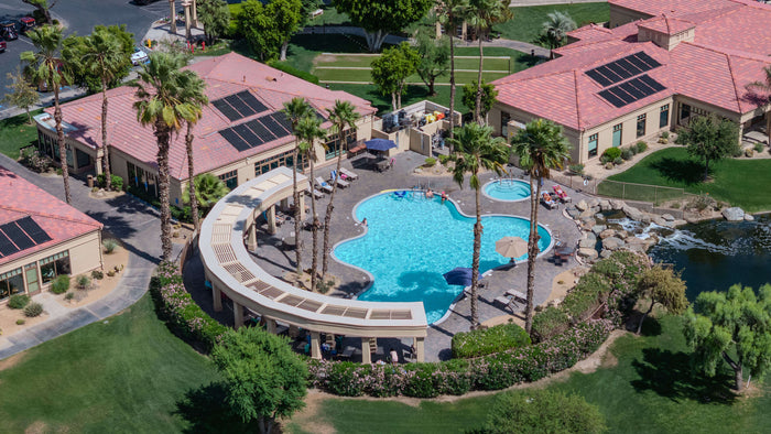 Aerial view of the outdoor pool, spa, and fitness facilities at Heritage Palms Country Club in Indio