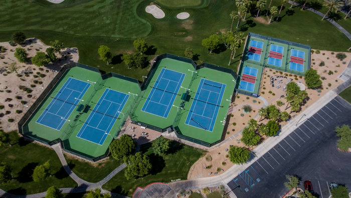 Aerial view of the tennis and pickleball court complex at Heritage Palms Country Club in Indio