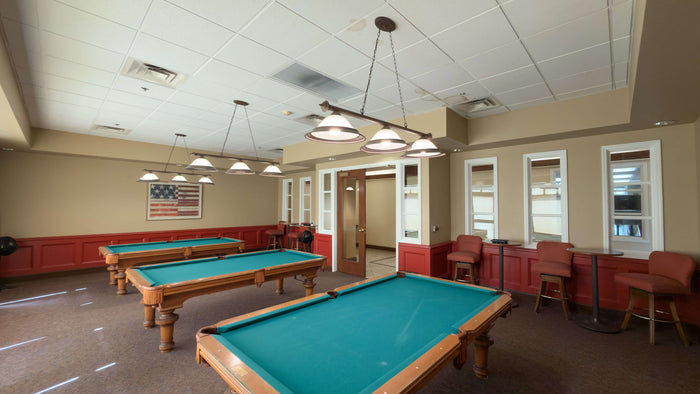 Billiards room with three pool tables inside the Heritage Palms clubhouse