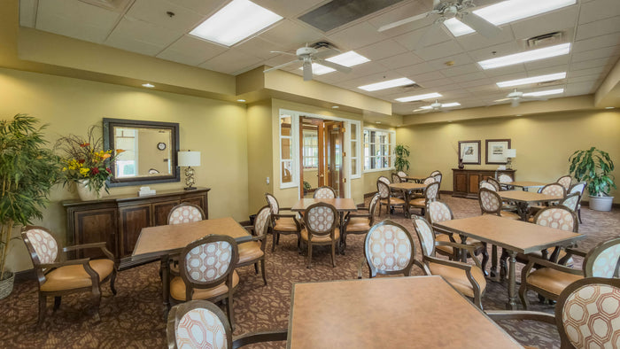 Heritage Palms clubhouse card and game room with multiple tables