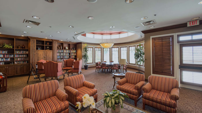 Heritage Palms clubhouse card and game room with multiple tables