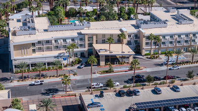 Closer aerial view of Hotel Paseo’s Larkspur Grill, signed entrance and balconies — Mark Miller, October 29, 2026.