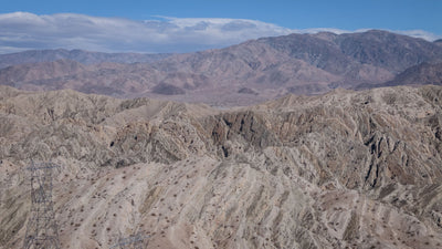Layered Indio Hills badlands with rugged ridgelines and distant mountains, photographed by Mark Miller on September 29, 2026.