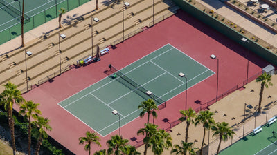 Players on Ironwood Country Club stadium tennis court