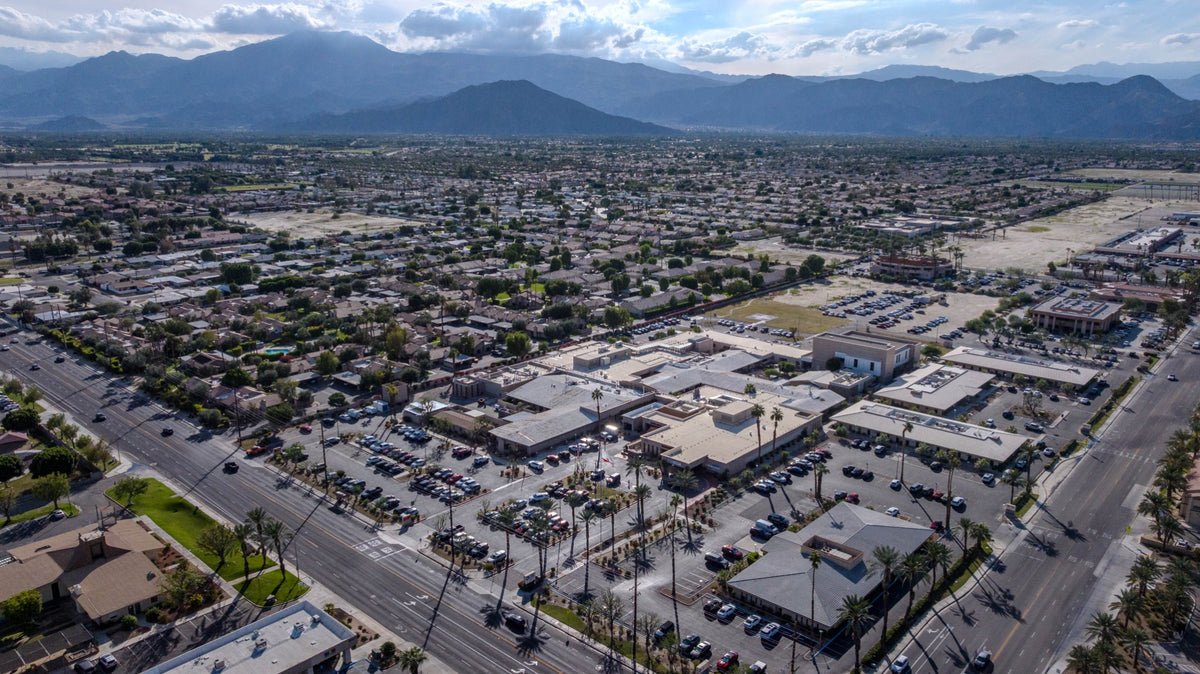 JFK Memorial Hospital campus in Indio with surrounding neighborhoods and mountains, photographed by Mark Miller on October 29, 2026