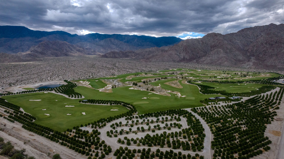 Ladera Golf Club fairways, orchards and Santa Rosa Mountains beneath dramatic clouds. Thermal, California. Mark Miller, October 23, 2026.