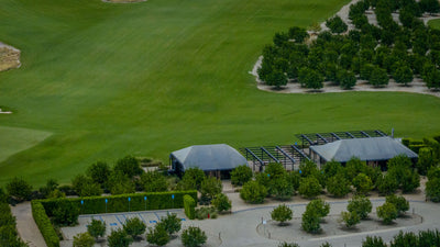 Low buildings beside fairways and orchards at Ladera Golf Club. Thermal, California. Mark Miller, October 23, 2026.