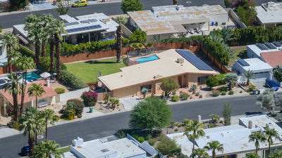 Aerial close-up of Magnesia Falls Cove homes, private pools, and desert landscaping