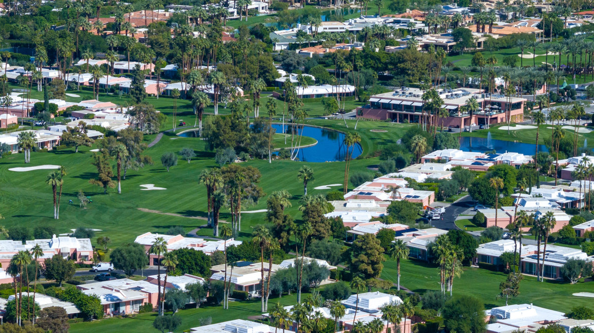Marrakesh Country Club clubhouse, lakes and pink villas beside the golf course.
