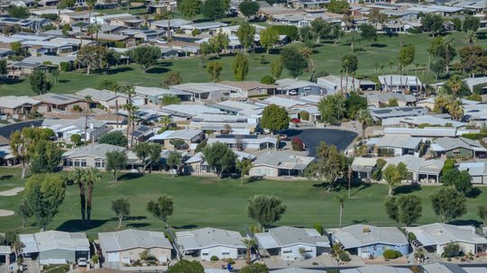 Aerial view across Palm Desert Greens fairways and homes