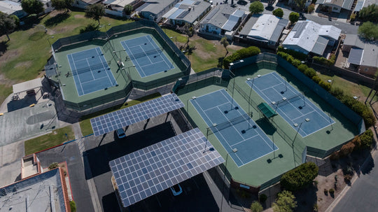 Aerial view of Palm Desert Greens tennis courts and solar-covered parking