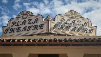 Detail of the Plaza Theatre rooftop signs above the red tile roof. Photograph by Mark Miller, October 20, 2026.