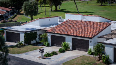 Tile-roofed homes, garages and golf course at Rancho Las Palmas Country Club