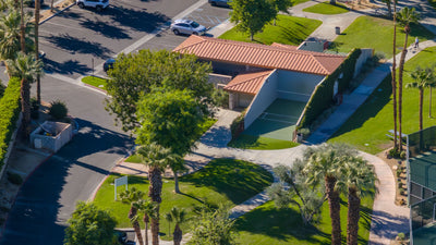 Open-air walled handball courts with green playing surfaces at Rancho Mirage Community Park.