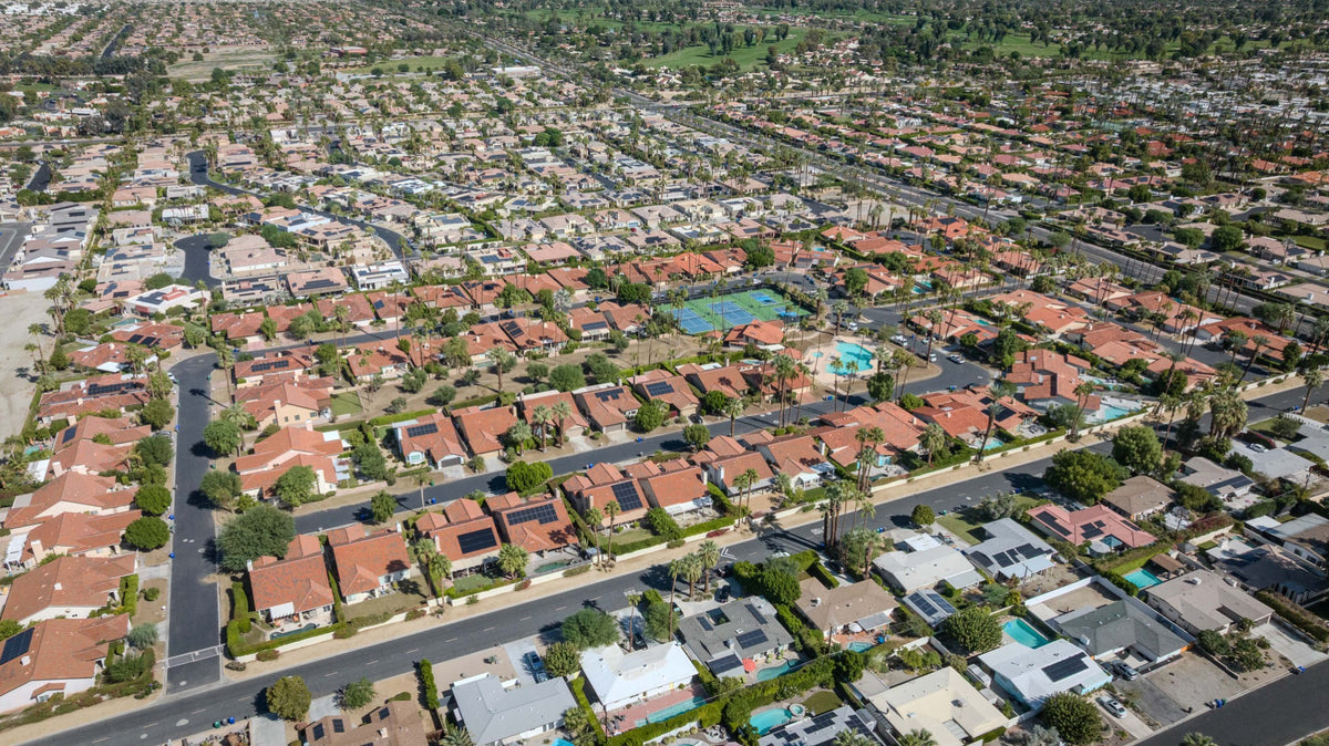 Aerial view of Rancho Village homes and central recreation area in Cathedral City.