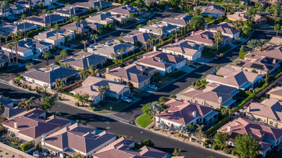 Detached Renaissance homes along palm-lined streets in La Quinta