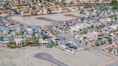 Completed Rio del Sol homes beside new streets and undeveloped lots.