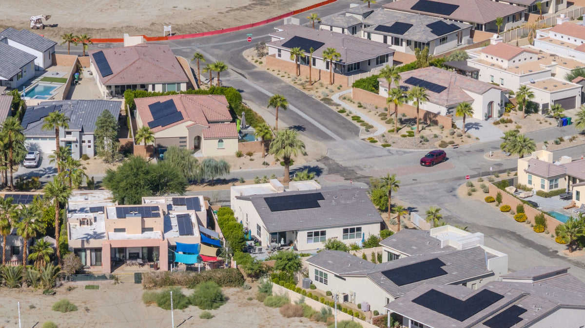 Rio del Sol homes with varied rooflines, courtyard walls and desert landscaping.