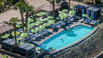 Close aerial view of the curved pool, cabanas and lounge chairs at The Ritz-Carlton, Rancho Mirage