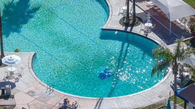Close aerial view of the curved pool edge and sunlit water at Shadow Mountain Resort, photographed by Mark Miller on October 15, 2026.