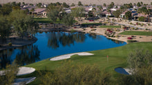 Golf course with a lake and residential area in the background at sun city shadow hills ca