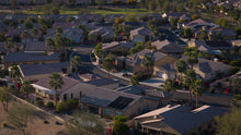 Aerial view of sun city shadow hills phase three with houses and palm trees.