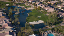 Aerial view of a golf course with lakes and residential houses in scsh phase 3