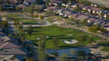 Aerial view of a golf course surrounded by residential houses in scsh 55 plus community in coachella valley ca