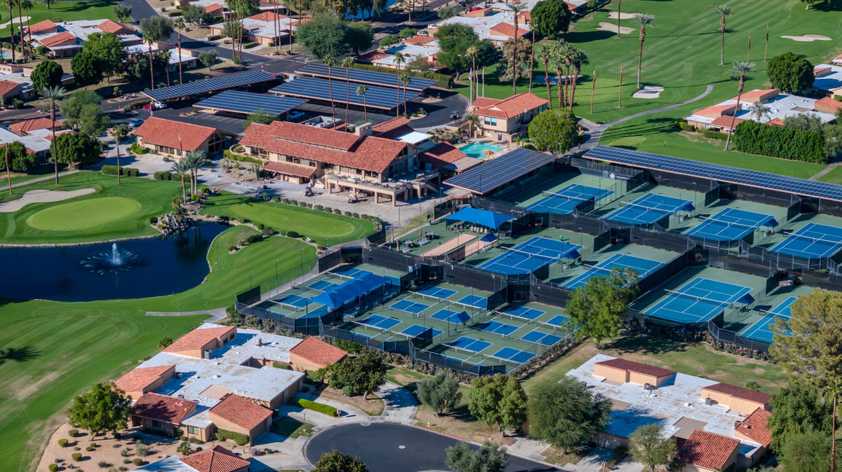 Tennis and pickleball courts beside the Sunrise Country Club clubhouse