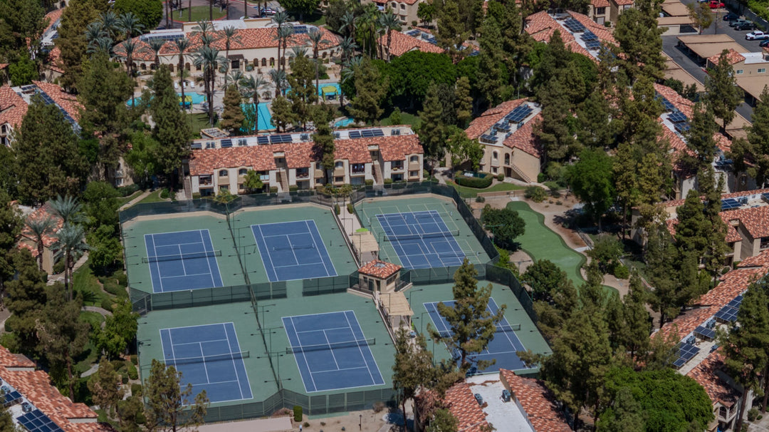 Aerial view of tennis courts, pickleball court markings and the putting green at The Regent Palm Desert. Photo by Mark Miller, September 10, 2026.