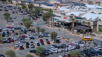 Aerial view of the main entrance at The Shops at Palm Desert near Dick's Sporting Goods, City Wok, and Stuft Pizza Bar & Grill.