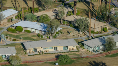 Aerial view of low-rise homes, patios and palms beside the Thunderbird golf course in Rancho Mirage, photographed by Mark Miller on October 13, 2026